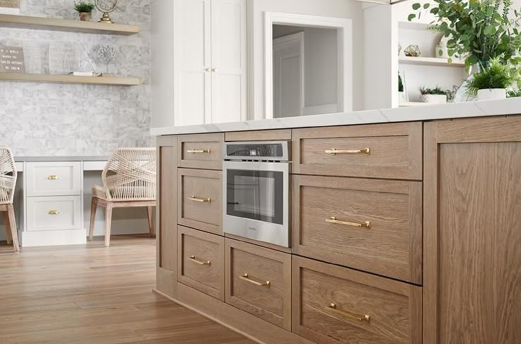 Brushed Brown Oak Kitchen Island With Polished Brass Pulls pertaining to Exploring the Craftsmanship of the Quincy Brown Oak and Brushed Stainless Steel Chest
