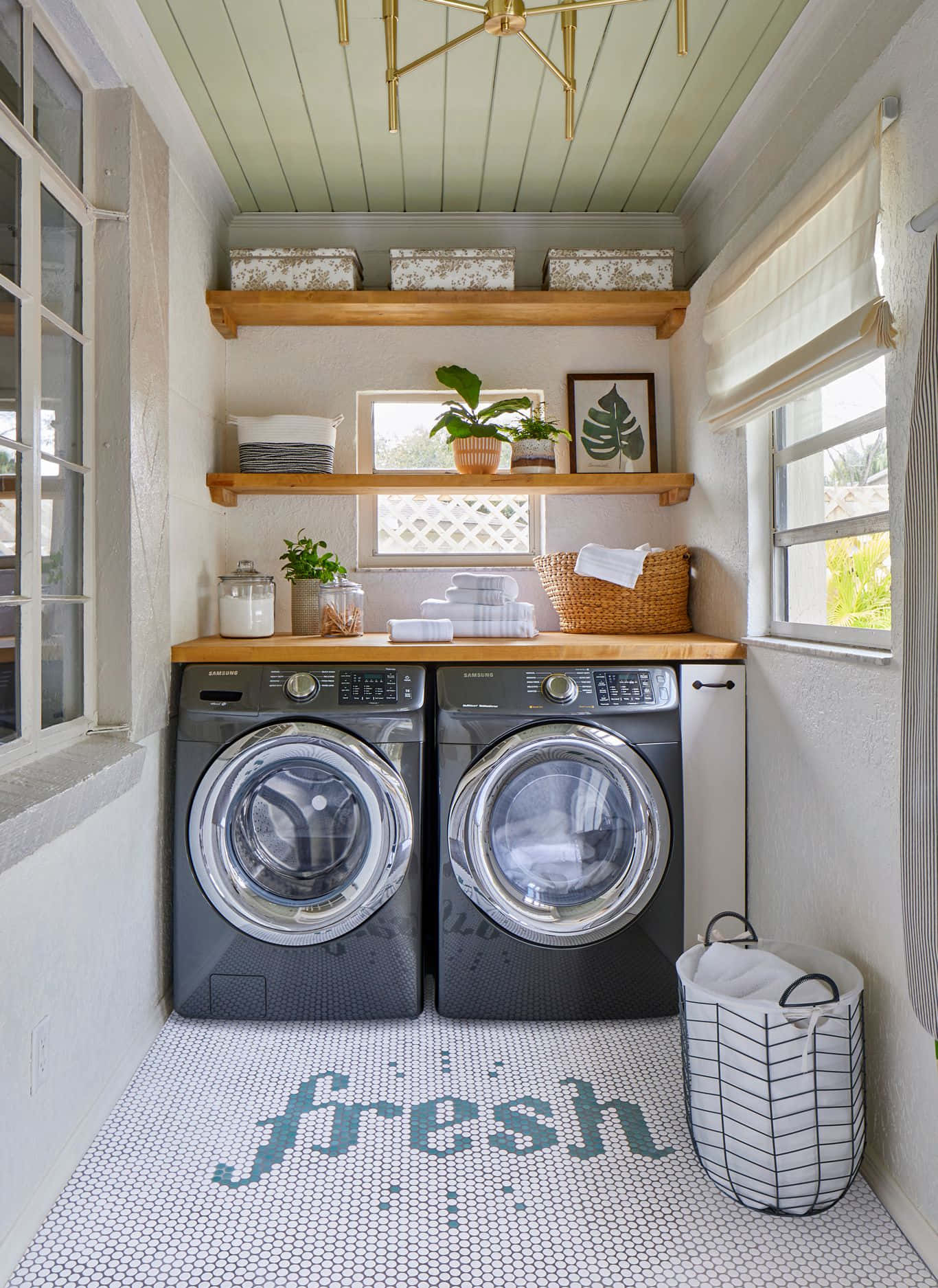 Download A Laundry Room With A Washer And Dryer | Wallpapers.com throughout From Drudgery to Delight Rethinking Laundry Room Design